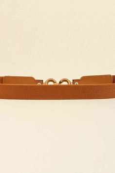 This stylish and durable PU Leather Belt is the perfect addition to any wardrobe. Made from high-quality materials, it offers both fashion and functionality. Upgrade your outfit and make a statement with this versatile and comfortable belt. Elevate your style with the PU Leather Belt today! Material: PU, alloy Imported Product measurements: Size: 24*1 in Buckle: 3.4 in Trendy Adjustable Brown Belt, Trendy Brown Belt For Workwear, Chic Brown Belt Buckles For Business, Chic Brown Business Belt, Modern Brown Belts For Office Wear, Trendy Belts For Everyday Use, Elegant Brown Belt For Everyday Use, Stylish Belts, Shapeless Dress