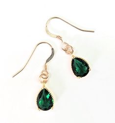 Sparkling green crystal drop earrings  Gorgeous rich emerald green crystal teardrop earrings. 14k gold filled earrings with glass crystal. Available as a set with matching necklace. Presentation boxed Formal Green Teardrop Gemstone Earrings, Gift Emerald Crystal Dangle Earrings, Elegant Green Teardrop Crystal Earrings, Green Teardrop Crystal Earrings, Green Emerald Drop Crystal Earrings, Emerald Drop Earrings, Emerald Green Crystal, Emerald Jewellery, Emerald Earrings Drop