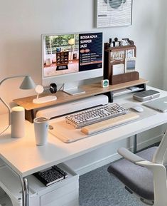 a desk with a computer, keyboard and mouse on it