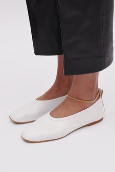 An elegant, architectural ballet flat that feels as good as it looks. Designed for everyday wear, these slip-on shoes are cut, sewn and crafted by hand from supple LWG Gold-certified leather and their shape is defined by the natural curve of the foot. The directional squared toe and flattering vamp give the humble ballet flat a simple yet modern update. DETAILS Colour: White Squared toe Slip-on Memory foam padding for extra comfort Leather lining and insole Heel height: 5mm / 0.2in Handmade in I White Ballerina Flats, Naha, Minimalist Wardrobe, Natural Curves, Comfortable Heels, The Foundation, White Flats, Leather Ballet Flats, Ballerina Flats