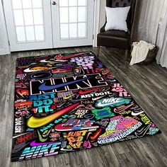 a room with a large rug covered in colorful stickers