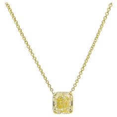 A stunning necklace with exuberant elegance- in this exceptional 5.19 carat Natural Fancy Yellow, Radiant cut diamond. This magnificent stone sits on a 4 prong setting and is attached on a 16-inch Italian gold cable chain. The stone mounted measures 0.42" in length and 0.38" in height Luxury Yellow Diamond Cut Necklace, Yellow Stone Pendant, Solitaire Necklace, Fancy Yellow Diamond, Diamond Solitaire Necklace, Radiant Cut Diamond, Solitaire Necklaces, Yellow Stone, Radiant Cut