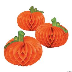 three orange paper pumpkins sitting on top of each other