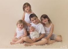 four children are posing for a photo with their newborn baby boy and his twin sister