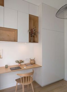 a wooden chair sitting in front of a desk