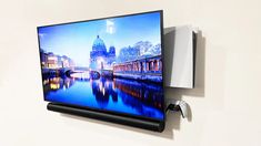 a flat screen tv mounted to the side of a wall