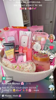 a basket filled with lots of different items on top of a table next to a mirror