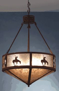 a chandelier hanging from the ceiling with three horses on it's sides