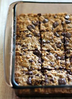 chocolate chip oatmeal bars in a glass baking dish on a wooden table