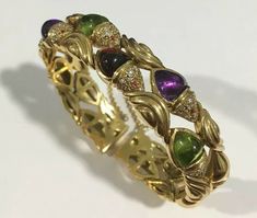 "Hi, Here we have a beautiful 18k yellow gold vintage bangle bracelet with diamonds and genuine color stones. Weight: 66.1g. Width: 1/2\". Standard 7\". In excellent condition The perfect gift for your loved one. Comes with a free gift box. Buy with confidence, we only sell top quality items. Thanks for looking and have a great day." Vintage Bangle Bracelets, Vintage Bangles, Link Bracelets, Stone Color, Floral Rings, Bracelet Watch, Colored Diamonds, Bangle Bracelets, Bangles