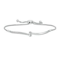 A clever choice for any occasion, this diamond bolo bracelet goes the fashion distance. Crafted in sterling silver, this style features curved polished and diamond-lined ribbons meeting in a sculpted knot at the center. Radiant with 1/15 ct. t.w. of diamonds and a brilliant buffed luster, this wheat chain bracelet adjusts up to 9.5 inches in length and secures with a bolo clasp and ball ends. Diamond Knot, Bolo Bracelet, Platinum Jewelry, Jewelry Essentials, Bracelet Clasps, Diamond Stone, White Metal, Bracelet Designs, Sterling Silver Bracelets