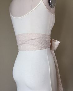 "Champagne Lace Sash Extra Long Lace Sash Champagne Wedding Dress Sash Lace Champagne Sash Belt Long Beige Lace Sash Satin Swank This Satin Swank® extra long sash in champagne floral lace brings a beautiful, yet simple romantic finishing touch to your wedding dress, or adds a hint of nostalgic charm to an everyday dress or top. At 120 inches in length, this sash will wrap around most waist sizes two times with a generous length remaining to tie in a bow or a simple knot with long-hanging tails. Fitted Bow Sash For Bridesmaid, Formal Fitted Sash With Tie Back, Formal Fitted Sash With Tie Waist, Fitted Bridal Belt With Ribbon For Wedding, Elegant Fitted Sash With Tie Back, Fitted Bridesmaid Sash With Bow, Elegant Fitted Tie Waist Sash, Elegant Fitted Sashes With Tie Back, Elegant Fitted Sashes With Matching Belt