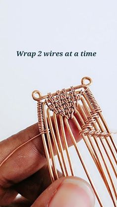 a person is holding some kind of metal item in their hand with the caption wrap 2 wires at a time