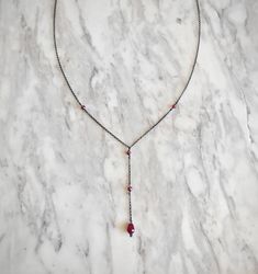 Artemis Dreaming. Βeauty and magic in the most delicately dark way. This necklace is composed of black rhodium over 925 sterling silver delicate sparkling chain, four burgundy garnet gemstones and a tiny burgundy agate drop. You can choose between these chain lengths: 15 / 16 / 17 / 18 inches Not sure which length to buy? We can add a 1 inch extender chain. Just write a note at checkout! ❈ We send all our items with registered mail. ❉ Due to the organic nature of stones, there might be a slight Handmade Gothic Dangle Necklaces, Gothic Dangle Necklaces For Jewelry Making, Gothic Sterling Silver Necklaces For Parties, Gothic Dangle Necklaces As Gifts, Gothic Dangle Necklaces For Gifts, Gothic Dangle Necklace For Gift, Gothic Hand Forged Pendant Necklace, Gothic Sterling Silver Wire Wrapped Jewelry, Wire Wrapped Drop Jewelry For Party