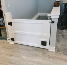 a dog house built into the side of a wall next to a carpeted floor