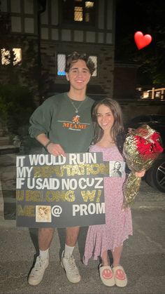 two people standing next to each other holding flowers and a sign that says i would run