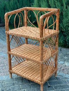 a wicker shelf sitting on top of a brick sidewalk