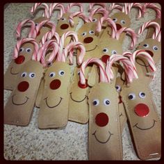 paper bags with candy canes in the shape of reindeer's faces and noses