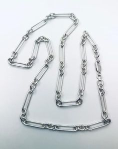 "inspired by my grandfathers watch chain of over 100 years ago. this is heavy (42 grams) solid silver 24\" long" Silver Jewelry With Rectangular Link Chain, Classic Silver Chain Necklace With Sterling Silver Clasp, Timeless Silver Link Jewelry, Silver Polished Chain Necklace, Timeless Silver Oval Link Jewelry, Silver Link Chain Necklace For Formal Events, Silver Link Chain Necklace For Formal Occasions, Formal Silver Link Chain Necklace, Classic Sterling Silver Chain Necklace With Paperclip Chain