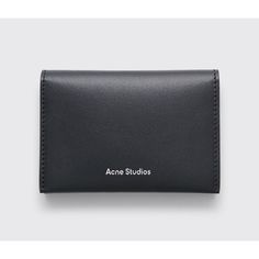 Card Case Wallet From Acne Studios. Made In Italy From Smooth Calfskin Leather. Features Four Card Slots And Embossed Logo On The Inside. Black Card Holder With Silver Tone Logo Print. Made In Italy From 100% Calfskin Leather. Measures Approximately 13,5 X 11 Cm. Acne Studios Card Holder, Black Leather Compact Coin Purse, Designer Black Leather Coin Purse, Compact Black Leather Coin Purse, Modern Black Bifold Coin Purse, Chic Leather Wallets With Card Slots, Compact Leather Bag With Rfid Blocking, Compact Black Leather Wallets, Compact Black Leather Wallet