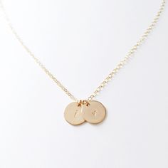 "Personalized, hand-stamped, 14k Gold Filled disc on a matching chain. Gorgeous, minimalist and perfect for layering! ✚ Disc measures 9mm ✚ Please msg me if you don't see your desired length (additional charges may apply) ✚ All necklace components are 14k Gold Filled (including jump rings) ✚ All jewelry is completely lead + nickel free Please note down the font you would like (see last picture) *3mm font can fit 1-2 letters per charm *1.5mm font can fit about 1-4 letters *Same goes for numbers i Simple Initial Pendant Charm Necklaces, Minimalist 14k Gold Filled Coin Necklace For Everyday, Everyday Dainty 14k Gold Coin Necklace, Dainty 14k Gold Filled Initial Necklace For Everyday, Minimalist 14k Gold Hypoallergenic Charm Necklace, Simple Everyday Charm Necklace With Initials, Minimalist Hypoallergenic 14k Gold Charm Necklace, Minimalist Tarnish Resistant Initial Pendant Coin Necklace, Dainty 14k Gold Filled Hand Stamped Necklace