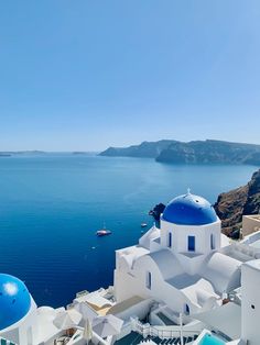 a blue and white building overlooking the ocean