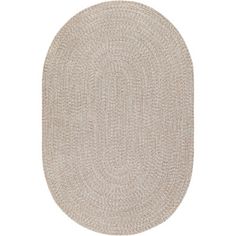 the oval rug is shown in beige