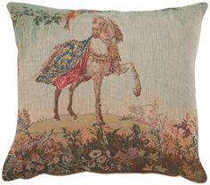 a decorative pillow with an image of a man riding a horse on the back of it