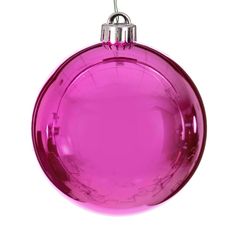 a pink ornament hanging on a white background