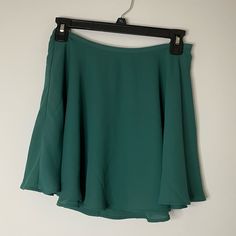 Beautiful Skirt With A Side Zipper Closure. Also Available In Black And Yellow. Mini Skort With Lined Skirt From Forever 21, Flowy Green Skort With Short Length, Green Mini Skirt For Day Out, Green Stretch Mini Skirt For Day Out, Forever 21 Stretch Skirt For Spring, Trendy Green Flared Mini Skirt, Chic Flared Skort From Forever 21, Green Flowy Skort In Short Length, Trendy Green Flowy Mini Skirt