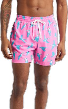 Pink Summer Swim Trunks For Water Sports, Pink Bottoms With Upf 50+ For Vacation, Pink Swim Trunks For Water Sports, Casual Pink Swim Trunks For Swimming, Pink Nylon Beach Shorts, Casual Pink Swimwear With Upf 50+, Pink Go-dry Shorts For Beach, Tropical Pink Swim Trunks For Beach, Pink Nylon Swim Trunks For Summer