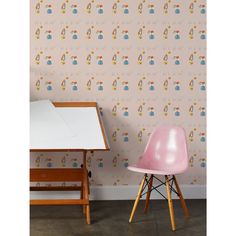 two chairs and a table in front of a wallpaper