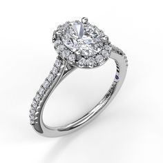 a diamond engagement ring on a white background