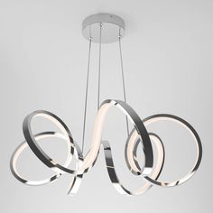 a modern chandelier with circular lights hanging from it's center circle design