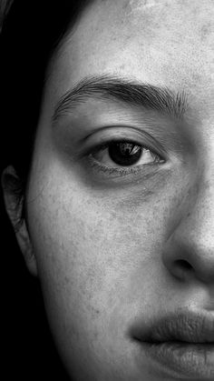 a close up of a person with freckles on their face