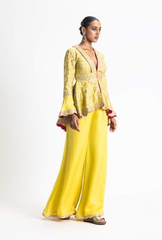 Radiate elegance in our mehndi yellow gota worked jacket with a peplum and contrasting pink backing on the scallop of the jacket. This stunning piece is paired with satin trousers, creating a perfect blend of tradition and contemporary style. Thread Beads, Traditional Jacket, Satin Trousers, Peplum Jacket, Yellow Jacket, Zari Work, Satin Color, Yellow Fabric, Bead Embroidery