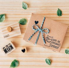 a wooden rubber stamp with an image of a dog on it and some leaves around it