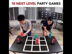 two people playing a game with cups on top of a table and the words 10 next level party games