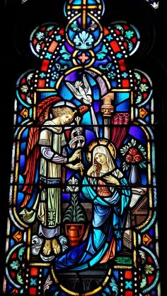 a stained glass window depicting the birth of jesus