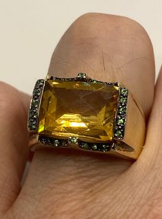 Vintage golden citrine and green chrome diopside 925 sterling silver cocktail ring Unusual cut of citrine in 925 sterling silver setting Handmade Size 7 Can be resized, my jeweler charges $10-$20 All rings are shipped in a nice gift box. Check out our over a THOUSAND great reviews Engraving is $4 per letter and is not always perfect depending on the piece. It can take a few days if the jeweler is busy. This is payable to Paypal Judithsltd@gmail.com Oval Citrine Green Jewelry, Oval Green Citrine Jewelry, Formal Green Citrine Jewelry, Green Citrine Jewelry With Gemstone Accents, Elegant Green Citrine Jewelry, Fine Green Citrine Jewelry, Formal Gold Faceted Emerald Ring, Green Multi-stone Topaz Ring For Formal Occasions, Gold Jewelry With Accent Stones For Parties