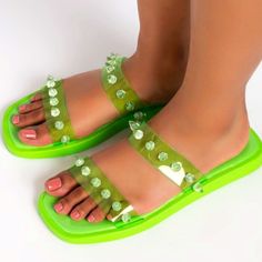 New Size 8 These Candy-Like Jelly Sandals Are A Sweet Treat. The Azalea Wang Sweet Like Me Flat Sandal In Neon Green Apple Features A Flat Rubber Base, A Vegan Patent Leather Sole, A Dual Pvc Strap Upper, Clear Pyramid Studded Detailing, An Open Square Toe Silhouette, And A Slip-On Fit. Complete Your Look With High Waisted Shorts And A Button Down Shirt. Open Toe Flat Sole Slip On Fit Imported #882 J1 Trendy Green Flat Sandals, Green Summer Jelly Sandals, Green Jelly Sandals With Round Toe For Summer, Green Flat Jelly Sandals Casual Style, Green Summer Jelly Sandals With Round Toe, Casual Green Jelly Sandals For The Beach, Trendy Green Sandals For Vacation, Trendy Green Vacation Sandals, Summer Vacation Green Jelly Sandals