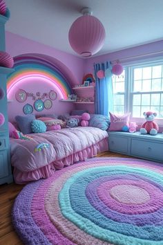 a bedroom with pink, blue and purple decor on the walls is decorated in pastel colors