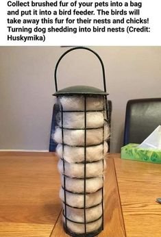 a stack of white balls sitting on top of a wooden table