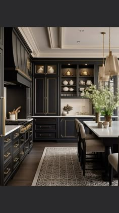 an elegant kitchen with black cabinets and gold accents