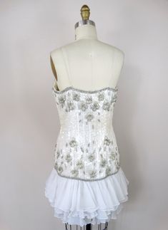 "This is a gorgeous little vintage couture dress! It's completely hand sewn, embellished with white sequins, glass beading and accented with iridescent rhinestone crystals. It's in excellent condition! Bust - 36\" Waist - 29\" Hips - 38\" Length - 33\" Tag Size - 8 All of my items come from a pet-free and smoke-free home. If you would like more info or have any questions, please don't hesitate to ask!" Sequined Mini Dress, Mini Dress Vintage, Iridescent Dress, Ruffled Mini Dress, Checkered Jacket, Couture Dress, Rhinestone Dress, Vintage Couture, Bustier Dress