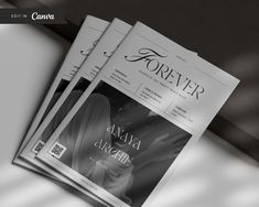 three magazines sitting on top of a table next to each other with black and white images