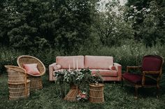 an outdoor setting with wicker furniture and pink cushions