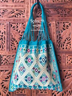 "This gorgeous embroidered Mexican Satchel or Morral is perfect to style with any outfit! The traditional Mexican embroidery is full of culture and colors. This Bag is embroidered on a waist loom. Dimensions: 15.5\" x 15.5\"" Traditional Bags With Multicolor Embroidery And Handwork, Blue Embroidered Bag For Daily Use, Handmade Blue Shoulder Bag For Festivals, Traditional Bag With Multicolor Embroidery, Multicolor Embroidered Woven Motifs Shoulder Bag For Everyday Use, Multicolor Embroidered Shoulder Bag For Everyday Use, Blue Handwoven Festival Bag, Traditional Multicolor Embroidered Bag, Traditional Blue Shoulder Bag For Festivals