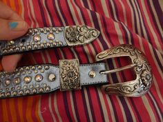 Rhinestone leather belt metal has some scratches but leather and stones are all perfect all stones are aurora borealis stamped 34 but no brand( may be before kippy had metal label)) also says A1 silver blue leather floral filigree buckles inside is black suede no curling, no separating, no fading only wear is some scratches on buckles 1.25 wide Silver Adjustable Belt With Rhinestones, Adjustable Silver Belt, Adjustable Silver Belt For Festival, Vintage Silver Belt Buckles For Festival, Vintage Silver Adjustable Belt, Silver Adjustable Belt With Antique Buckle, Adjustable Silver Belt With Antique Buckle, Western Silver Belt Buckles For Festival, Western Style Silver Belt Buckles For Festival