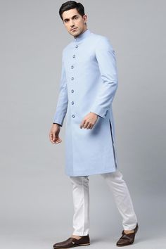 Product Features: Top Color: Sky Blue Bottom Color: White Work: Solid Top Fabric: Suiting Teri Cort Bottom Fabric: Art Silk Pack Of: 1 Sherwani and 1 Pant Occasion: Partywear Disclaimer: There will be slight difference in digital to actual image Light Blue Sherwani, Festival Blue Sherwani In Art Silk, Sky Blue Sherwani, Blue Raw Silk Sherwani, Blue Cotton Silk Long Sleeve Sherwani, Top Fabric, Solid Tops, Male Art, White Wash